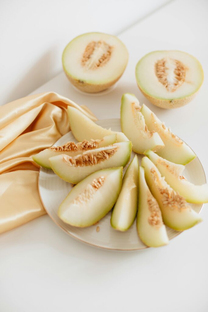 Photo Of Sliced Melon On Plate